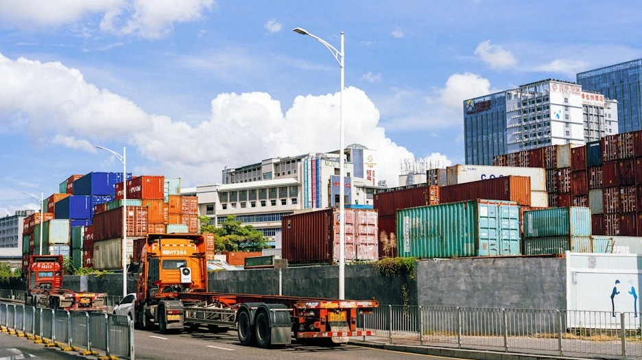 Isometric illustration of a global logistics network with ships, planes, and trucks connecting warehouses.